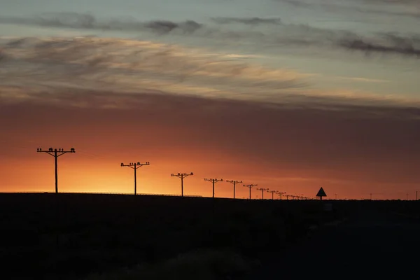 Row Utility Poles Outdoors Breathtaking Sunset — Stock Photo, Image