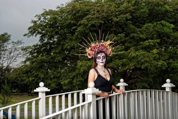 Young woman with sugar skull makeup. Day of The Dead. Catrina portrait.