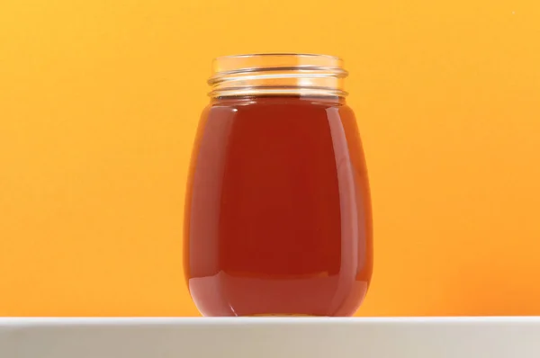 One Full Honey Jar Colored Background — Stock Photo, Image