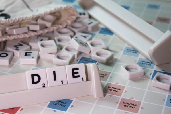 Closeup White Cubes Spelling Word Die Board Game — Stock Photo, Image