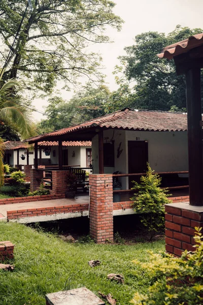 The vertical shot of forest resort brick houses