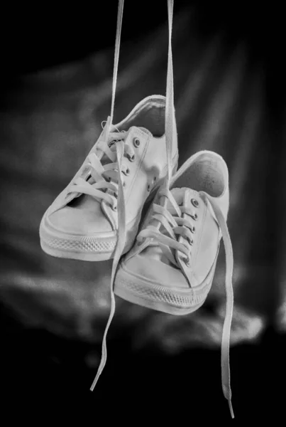 Closeup Shot White Sneakers Hanging Laces Grayscale Symbolism Remembering Dead — Stock Photo, Image