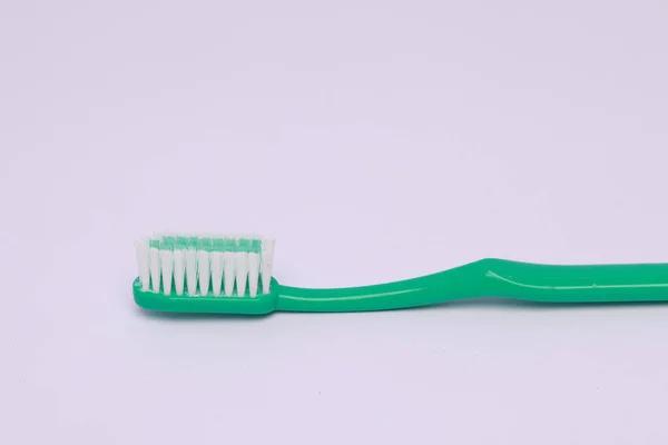 Closeup Green Toothbrush Isolated Pink Background — Stock Photo, Image