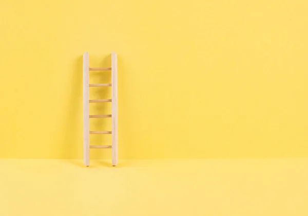 Ladder of success, opportunity strategy, yellow background, copy space for text, step by step concept, progress in business and education, have a goal