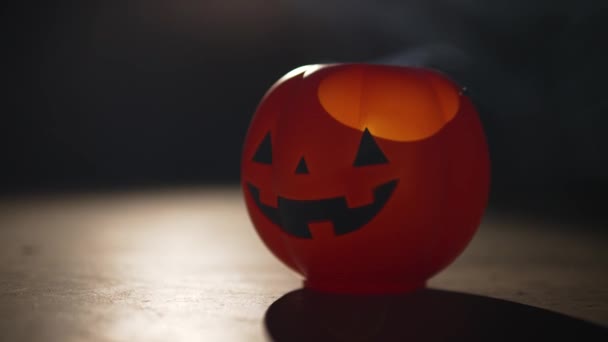 Spotlight Empty Halloween Pumpkin Candy Bucket — Stock video