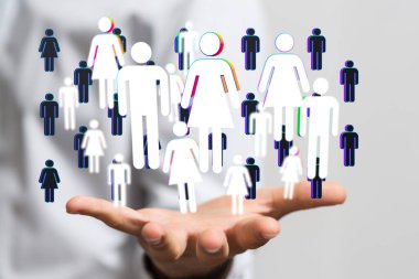 Bir sunum sırasında bir kişinin elinin üzerinde beyaz ve mavi simgeleri olan resimli bir ağ grafiği