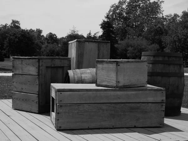 Grayscale View Wooden Boxes Barrels Rural Area — Stock Photo, Image