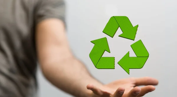 A 3D rendering of a floating recycling icon on a man's hand