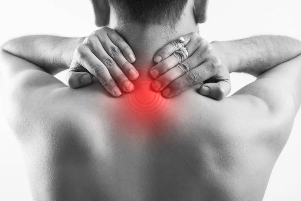 black and white man holding his neck due to pain, red highlight on neck, cervical spinal cord injury