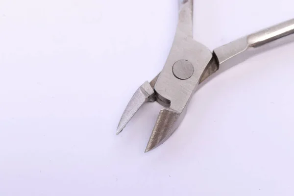 Zbliżenie Stalowego Noża Paznokci Izolowanego Białym Tle — Zdjęcie stockowe