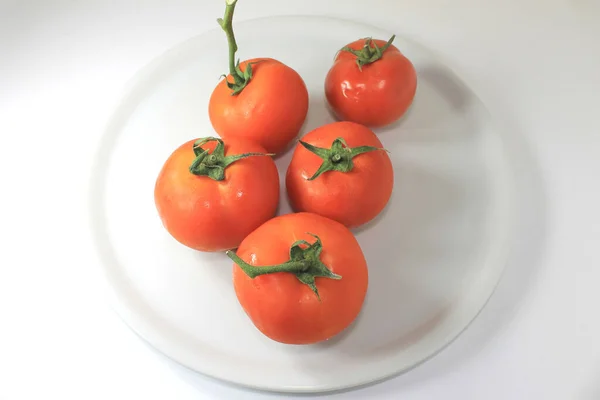 Closeup Coppery Tomatoes White Plate — Stock Photo, Image