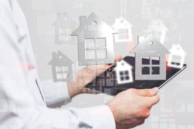 Bir tabletin üzerinde sinirsel ağlar ve büyük veriler bulunan üç boyutlu bir ev görüntülemesi