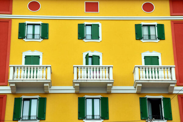 View of a building with bright colors in a main street of Milan, Italy
