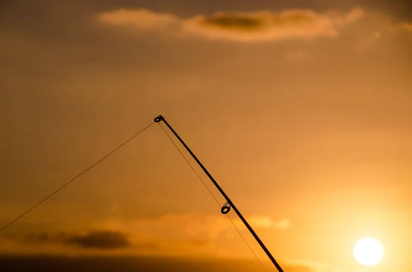 Silueta Caña Pescar Pescador Atardecer Naranja —  Fotos de Stock