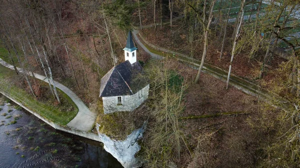 Aerial Shot Chapel Surrounded Leafless Trees River Daytime — Stock Photo, Image
