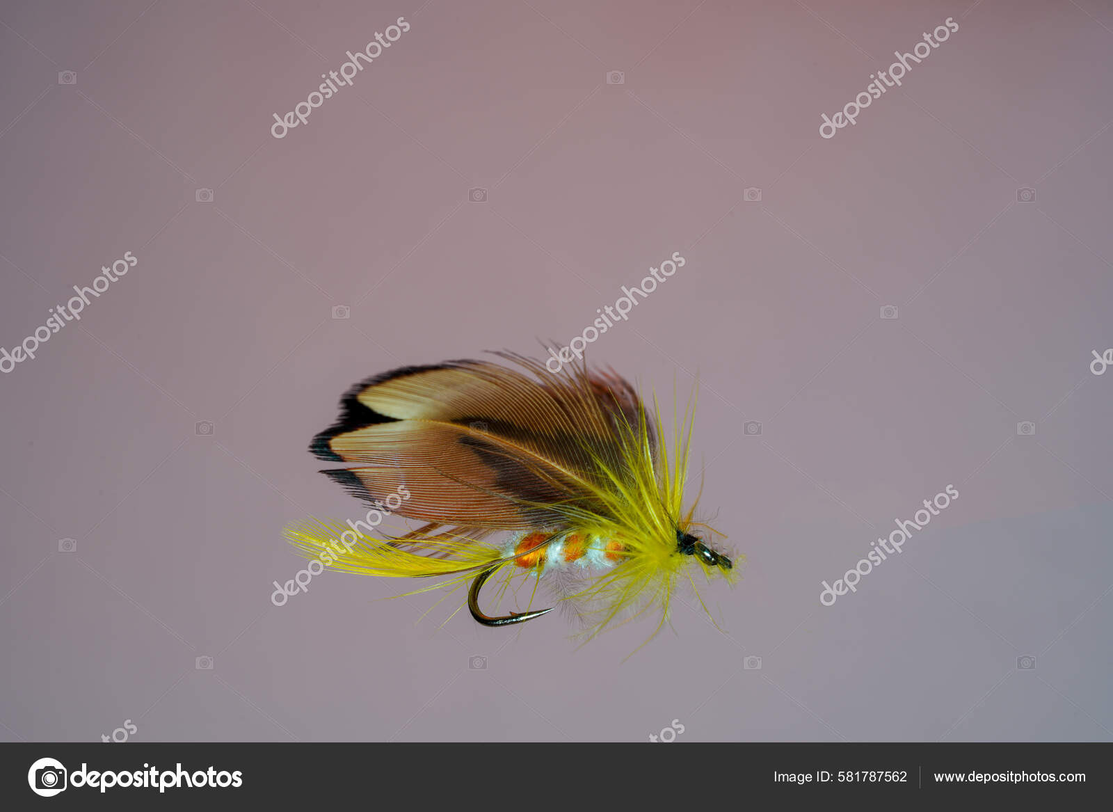 Tied Fluffy Yellow Fishing Fly Lure Isolated Blue Background — Stock Photo  © wirestock_creators #581787562