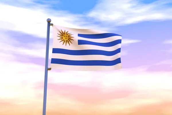 A waving flag of Uruguay on a flag pole with the cloudy sky on the background