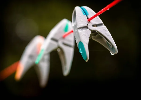 Closeup Shot Plastic Clothes Pegs Washing Line Rain — Stock Photo, Image