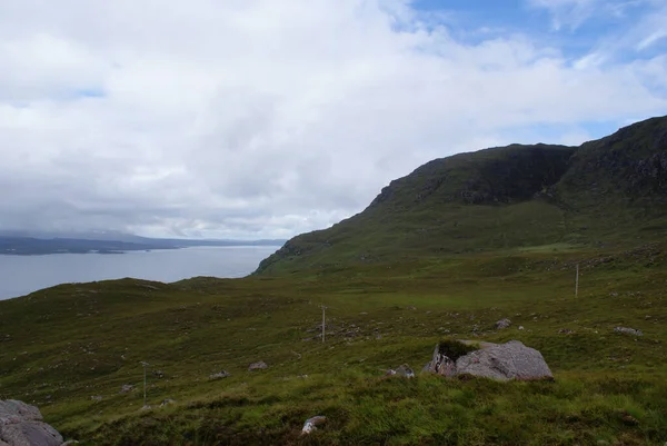 Scenic View Grassy Terrain Electric Posts Gloomy Sky Scotland — Stock Photo, Image