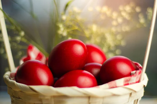 Closeup Shot Easter Red Eggs Wicker Basket Blurred Background — Stock Photo, Image