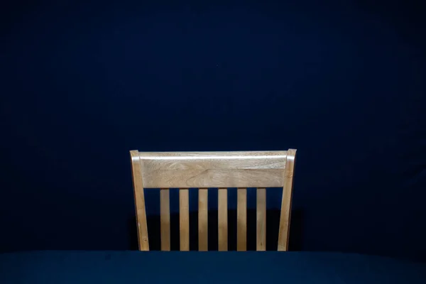 Single Wooden Chair Front Table Dark Blue Background Royalty Free Stock Images