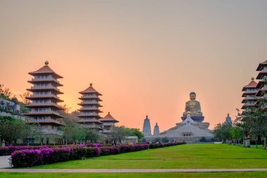 The view of Fo Guang Shan Buddha Museum against the background of sunset. clipart