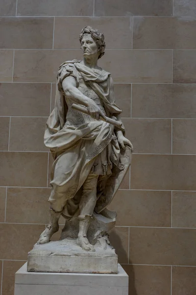 A vertical shot of Julius Caesar sculpture in museum, Paris, France