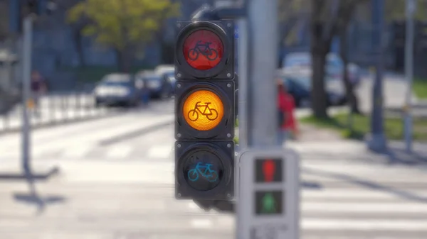 A shallow focus of a traffic bicycle lights in the streets on a blurred background