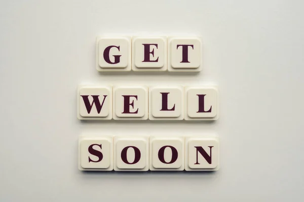 Closeup Scrabble Tiles Letters Spelling Message Get Well Soon White — Stock Photo, Image