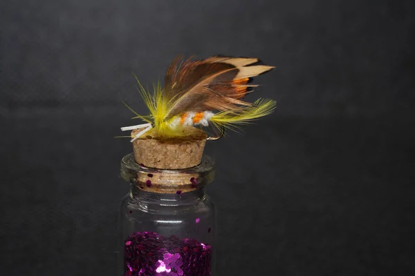 Closeup Tied Fluffy Fishing Fly Lure Isolated Glass Bottle Purple — Stock Photo, Image