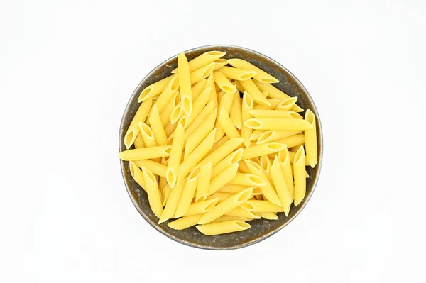 Top View Raw Penne Pasta White Background — Stock Photo, Image