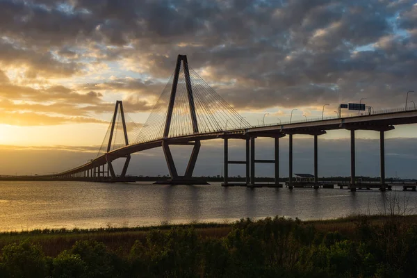 A scenic view of the Charleston South Carolina Bridge in the USA during sunset