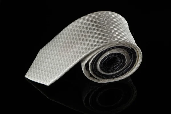 Closeup Gray Male Satin Necktie Roll Isolated Black Background — Stock Photo, Image