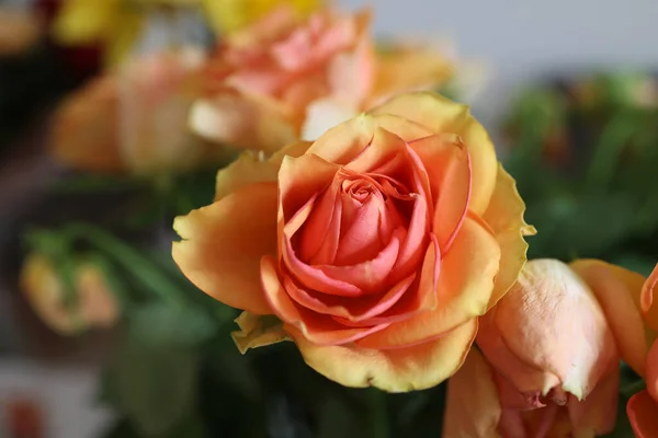 A closeup of a beautiful floral bouquet with orange roses