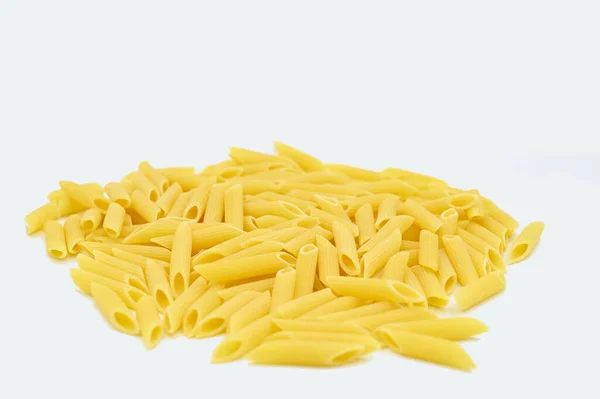 Closeup Raw Penne Pasta White Background — Stock Photo, Image