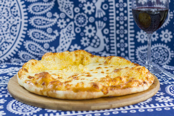 A closeup of Georgian traditional food khachapuri, cheese, and bread. Tbilisi, Georgia.