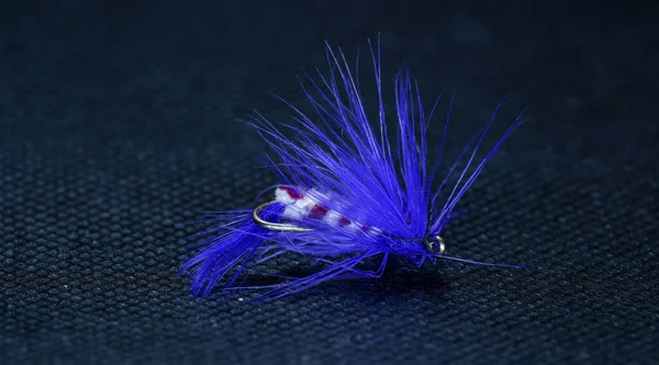 Closeup Tied Fluffy Fishing Fly Lure Isolated Blue Background — Stock Photo, Image
