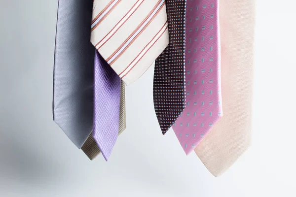 Closeup Colorful Men Ties Hanging Gray Background — Stock Photo, Image