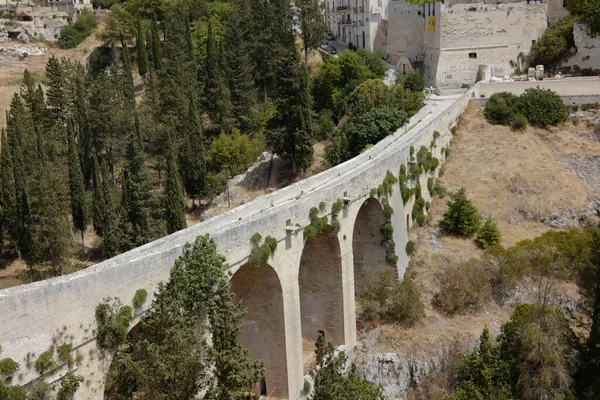 Famous Stone Arcade Bridge Gravina Puglia Italy Surrounded Green Trees — Stock Photo, Image