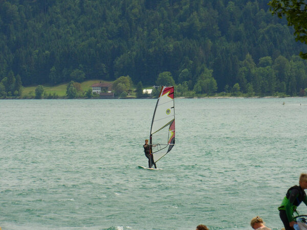A person windsurfing at Walchensee in the German Alps