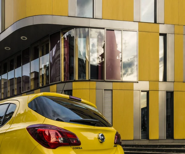 Yellow Opel Corsa Automobile Front Yellow Modern Building Aachen Germany — Stock Photo, Image