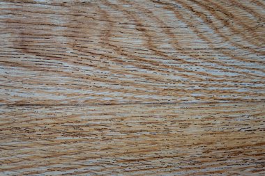 Ahşap dokulu bir arka planın yakın çekimi.