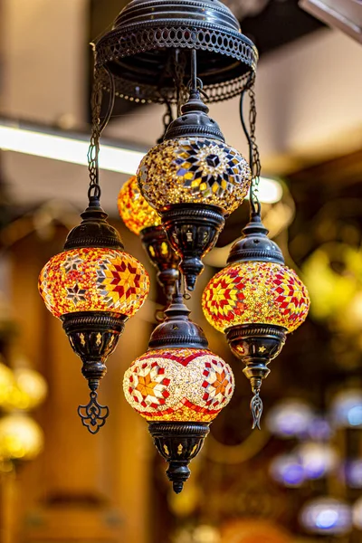 A vertical shot of Turkish lanterns for sale in the street market