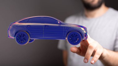 Bir erkek uçan holograma dokunuyor.