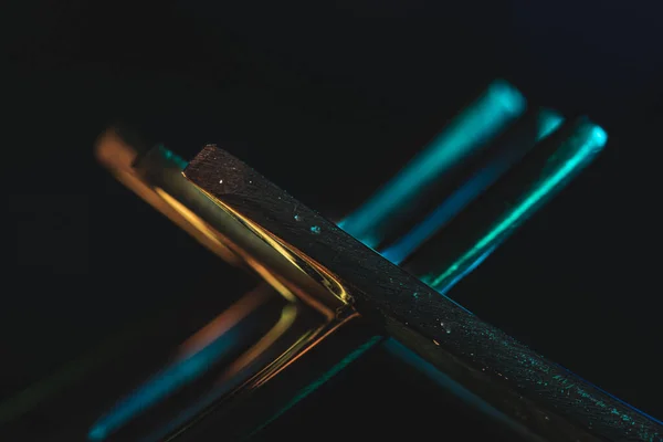 Closeup Shot Two Forks Dark Colorful Lights — Stock Photo, Image