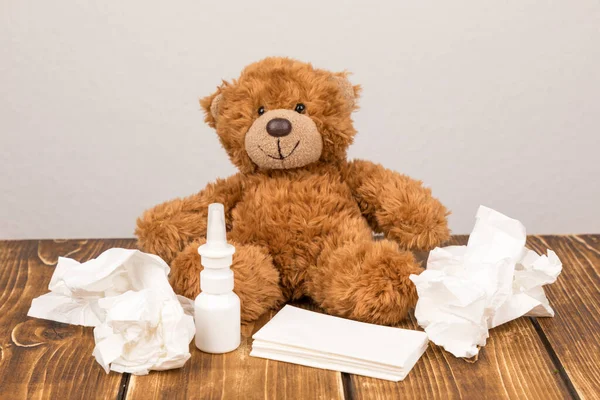 Fluffy Teddy Bear Nasal Spray Tissues Wooden Surface Suffering Illness — Stock Photo, Image