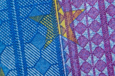 20 avroluk banknotun mavi ve mor detaylarının makro odak noktası.