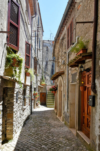A narrow street between old medieval buildings in Bracciano, Lazio, Italy