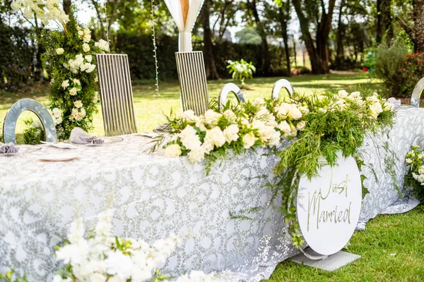 A decorative wedding table at an outdoor venue