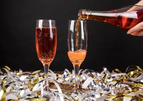 Closeup Glasses Red Champagne Streamers New Year Eve Party — Stock Photo, Image